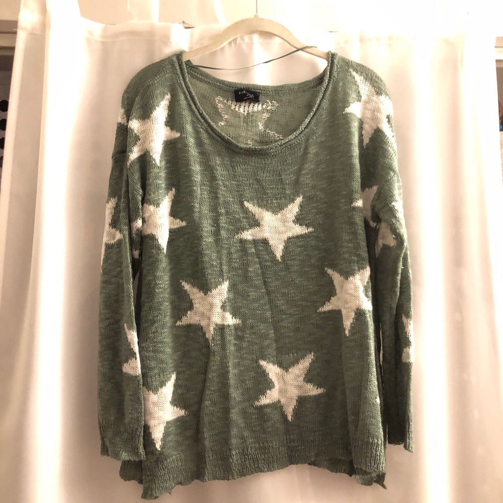 Green and white start sweater